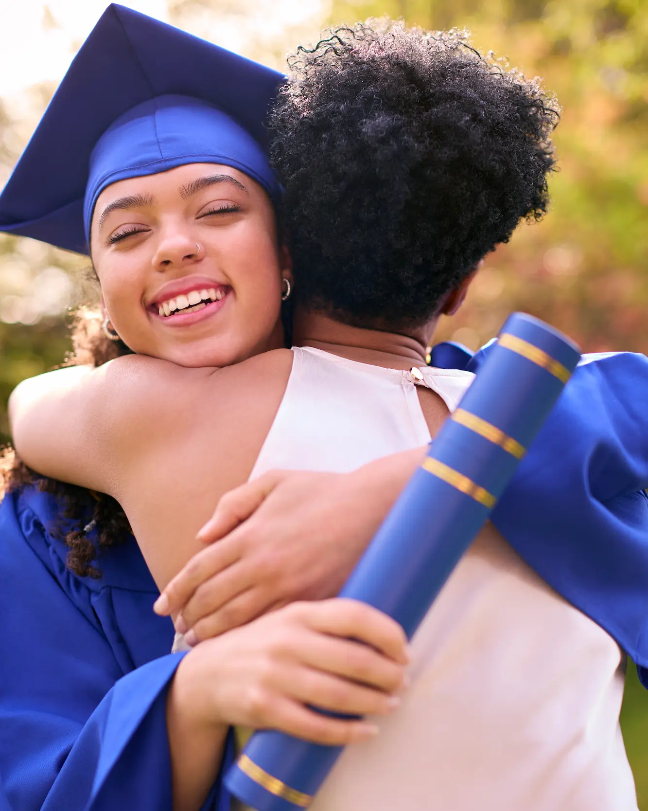 Mother celebrating with teenage daughter